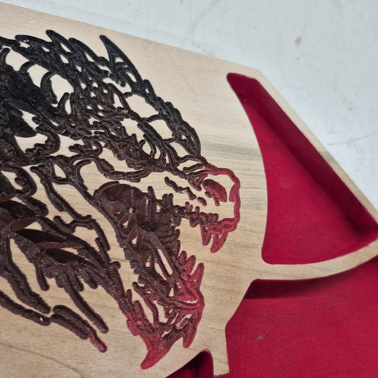 A tight close-up shot focusing on the roaring dragon head carving on the tray's border, highlighting the incredibly crisp CNC machining and the detailed multi-color paint scheme on the scales and horns.