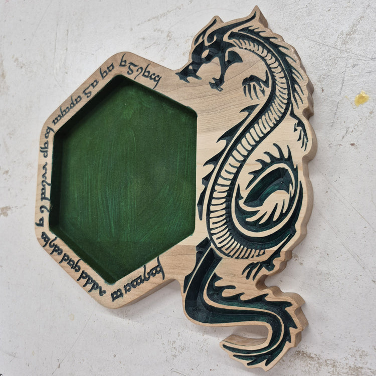 A perspective view from the opposite angle of the carved hexagonal tray, showcasing the smooth outer rim and the seamless transition to the green flocked interior rolling surface.