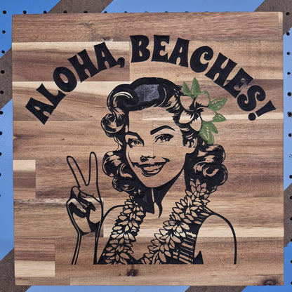 CNC Carved plaque saying Aloha, Beaches! with a 50's Pinup showing a Peace sign