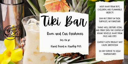 Whiskey River Craftworks "Tiki Bar" Room & Car Spray—an atmospheric odor neutralizer featuring an exotic, tropical scent profile of sparkling peach, pineapple, wild berries, plumeria, and creamy coconut crème.