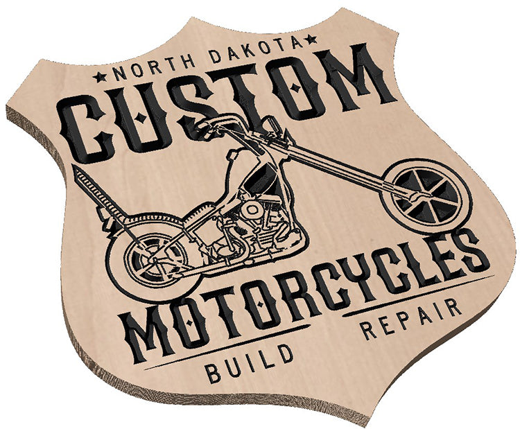 Close-up of the clean finish and natural wood grain on a hardwood biker shield sign.
