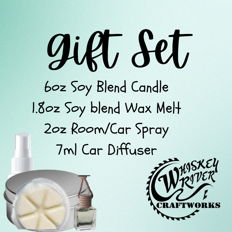 The Ultimate Fragrance Gift Set by Whiskey River Craftworks, featuring a 6oz soy-blend candle, 1.8oz soy wax melt, 2oz room/car spray, and a 7ml car diffuser, all presented on a light blue background.