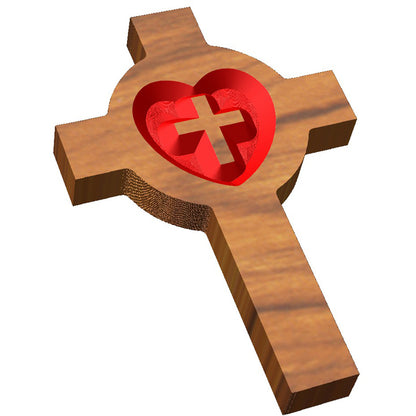 Angled shot of a relief carved hardwood Lutheran cross sign with a red heart design on a white background.