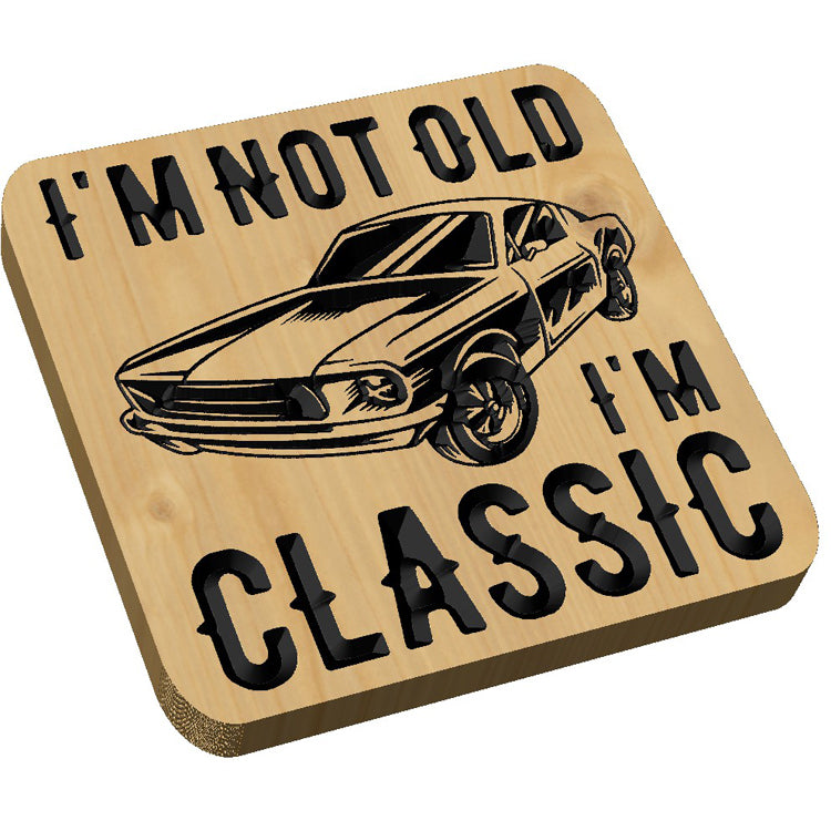 Angled shot of a relief carved hardwood sign with a classic car design and I'm Not Old, I'm Classic text on a white background.