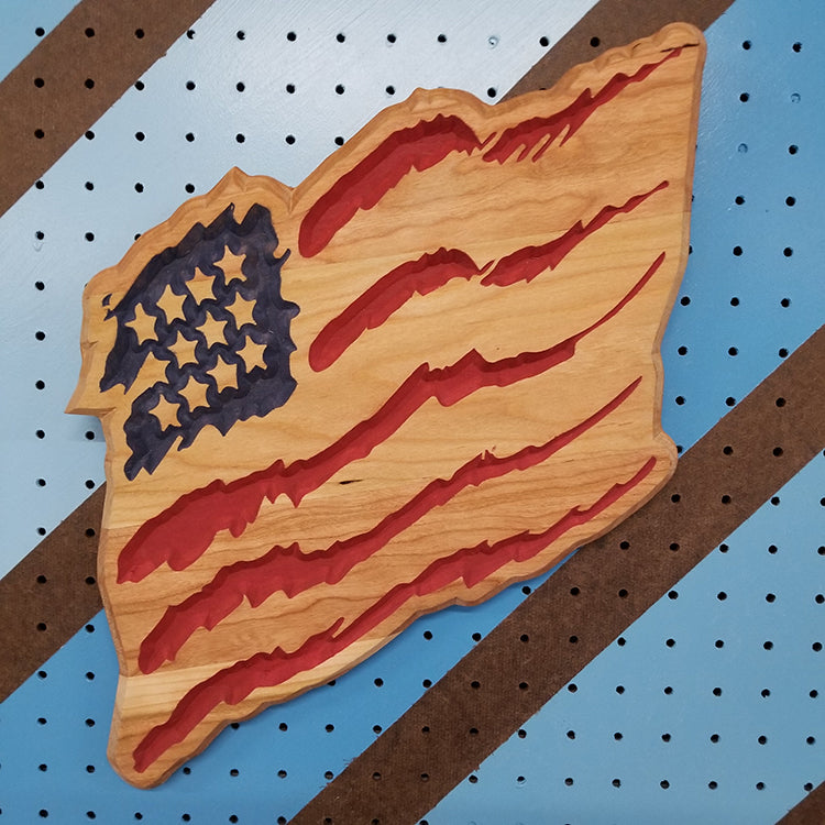 Handcrafted relief-carved hardwood "Claw Flag" sign featuring a distressed, stylized American flag design.