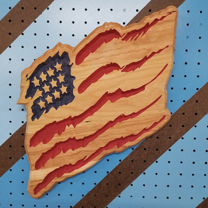 Handcrafted relief-carved hardwood "Claw Flag" sign featuring a distressed, stylized American flag design.