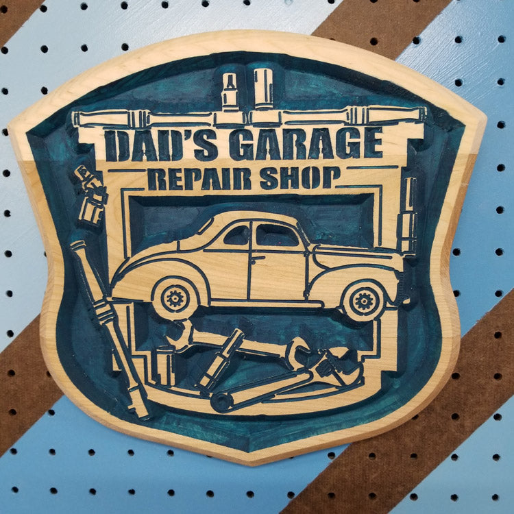 Relief carved hardwood "Dad's Garage" sign featuring customizable vintage car art and tool motif.