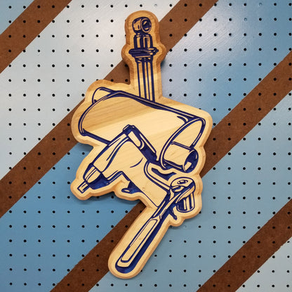 Custom hardwood garage sign with a carved relief design of a muffler, shock absorber, ratchet, and impact gun.