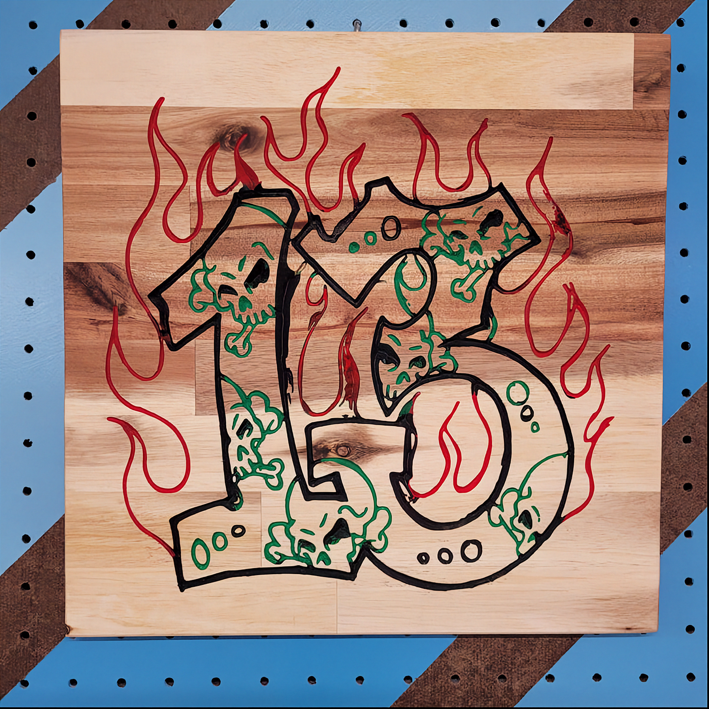 Handcrafted relief-carved hardwood sign featuring the number "13" stylized with skulls and flames.